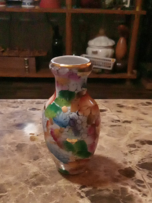 Porcelain miniature vase with hand-painted floral design and gold accents