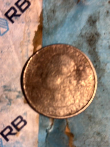 Off-center strike error coin, appears to be a modern U.S. cent