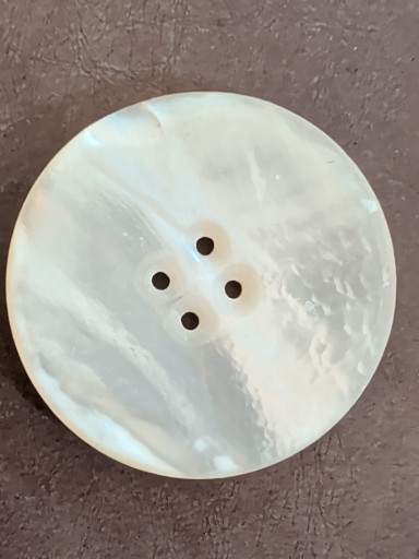 Mother-of-pearl button with four holes One and a half