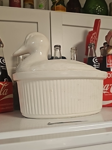 White ceramic duck-shaped covered casserole dish