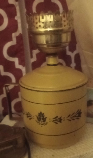 Vintage mustard yellow tole (toleware) metal table lamp with hurricane shade and decorative floral motif