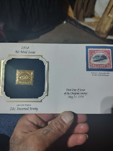 22kt gold replica of the 1918 24-cent Inverted Jenny airmail stamp