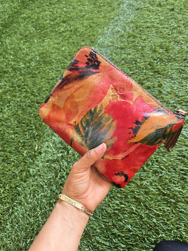 Leather wristlet wallet with floral print by Patricia Nash