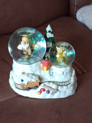 Ceramic and glass double snow globe titled 'Snow White and the Seven Dwarfs' by Enesco