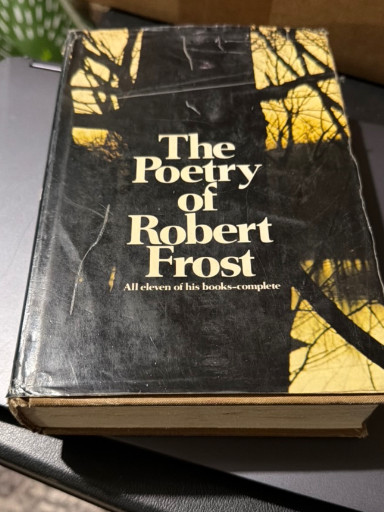 Hardcover book titled 'The Poetry of Robert Frost: All eleven of his books—complete' published by Henry Holt and Company