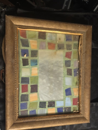 Framed stained glass window panel in Queen Anne style