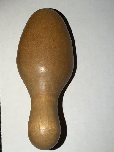 Wooden sock darning tool with egg-shaped head and handle