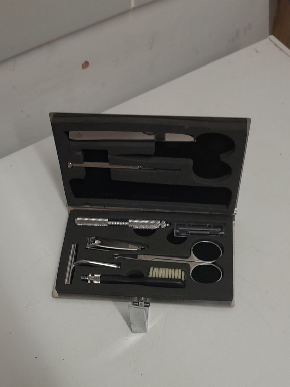 Vintage men's travel grooming kit in steel metal case
