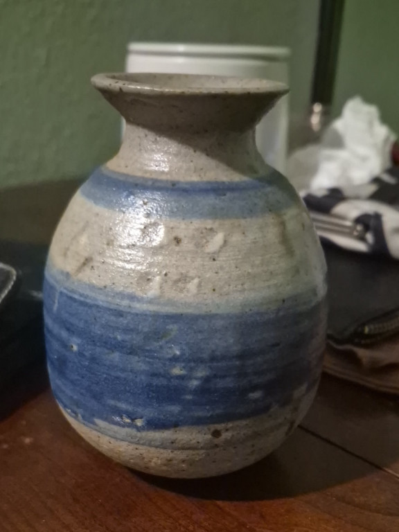 Ceramic pottery vase with blue and white striped glaze