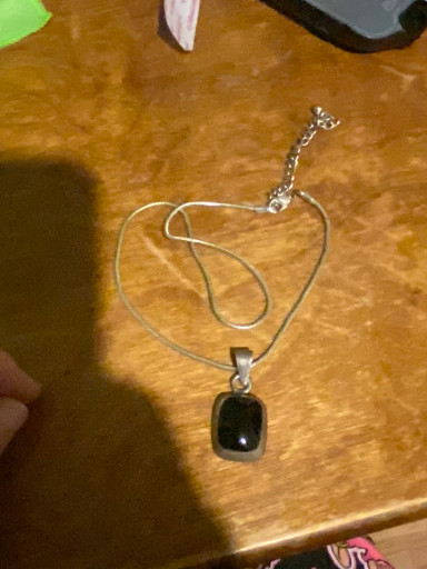 Sterling silver pendant necklace with cushion-cut black onyx stone, marked 'PLATA 925'