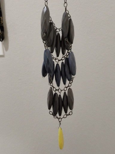 Contemporary statement necklace with gray acrylic beads and yellow pendant