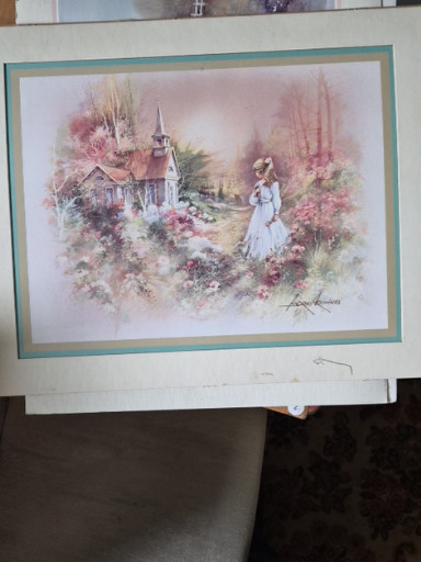 Framed print titled 'Girl with Church and Flowers' by Andres Orpinas