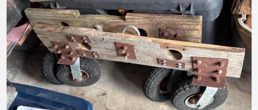 Vintage wooden industrial factory cart with metal wheels