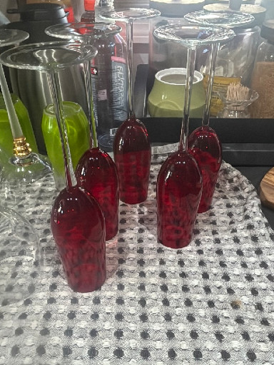 Set of ruby red crystal wine glasses with clear stems