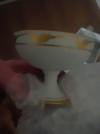 Porcelain compote or footed bowl with gold trim