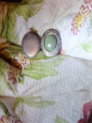 Silver-tone oval locket with green aventurine stone cabochon