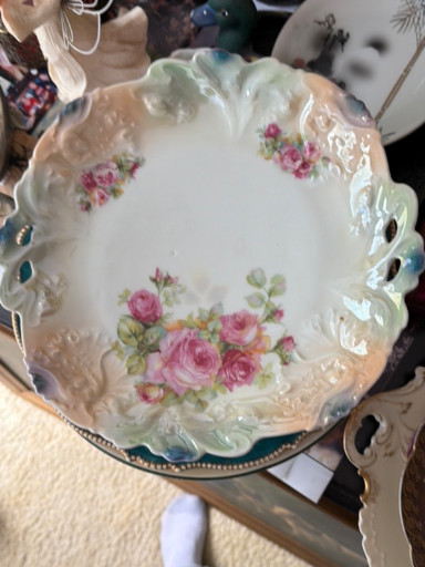 Porcelain bowl with scalloped edge, pierced handles, and hand-painted pink roses