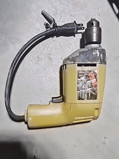 Vintage Black & Decker 7004 Type 1 electric drill, 1/4 inch chuck, yellow and gray housing