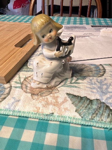Ceramic figurine of an angel playing a harp