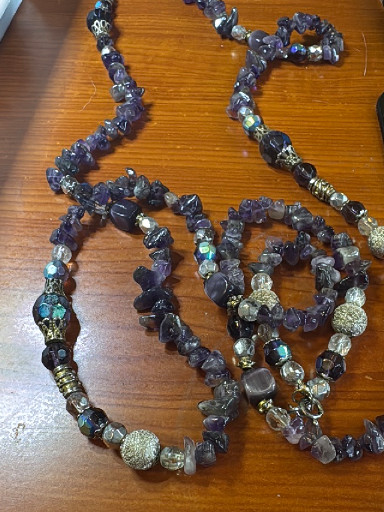 Multi-strand beaded necklace with amethyst chips and decorative metal beads