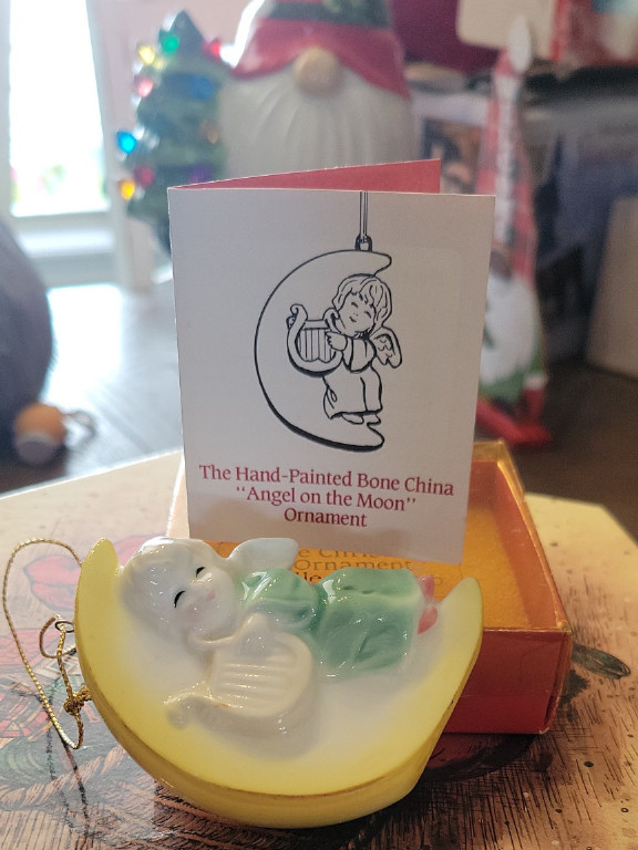 Bone china Christmas ornament titled 'Angel on the Moon'