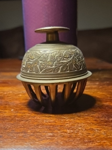 Brass claw bell with etched floral design