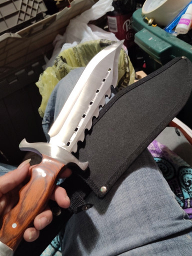 Stainless steel Bowie knife with sawback spine and hardwood handle Mossy Oak brand