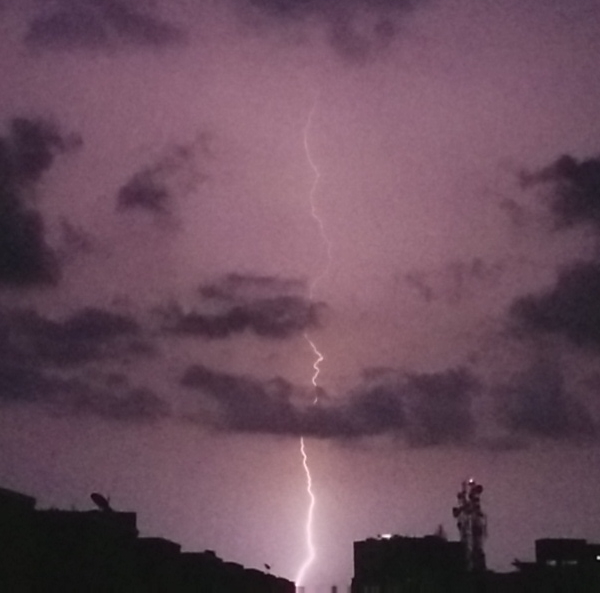 A flash of lightning across a dark sky