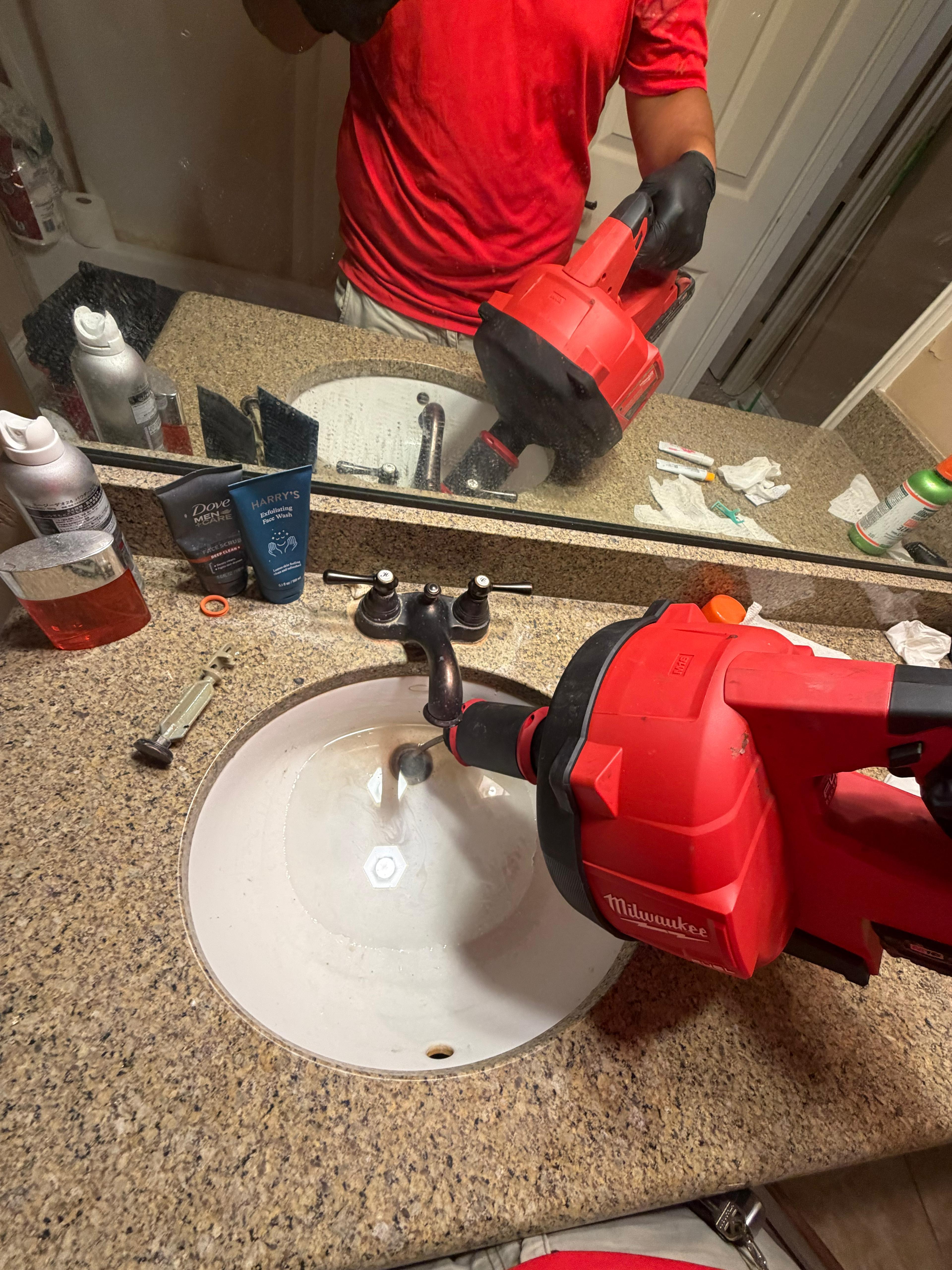 Calvin reported a clogged bathroom sink upon returning from a two-week trip, though the exact start date of the blockage is unknown. Service is scheduled between 2:00 p.m. and 4:00 p.m. (with a 30-minute call-ahead) to inspect the P-trap, clear the obstruction, and test the final drainage flow.
