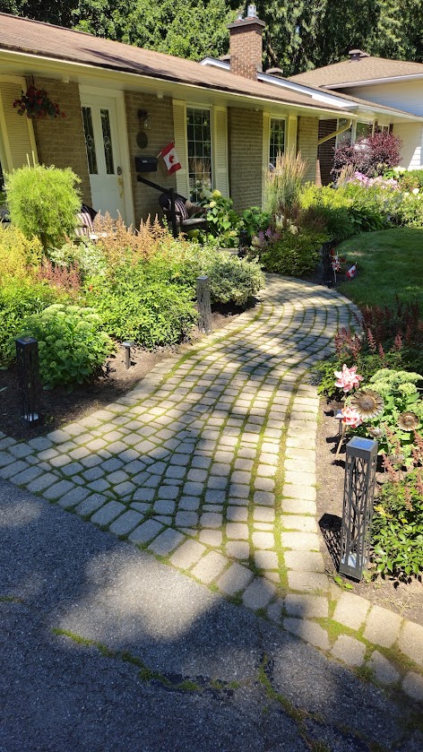 A sunken driveway entrance before repair.