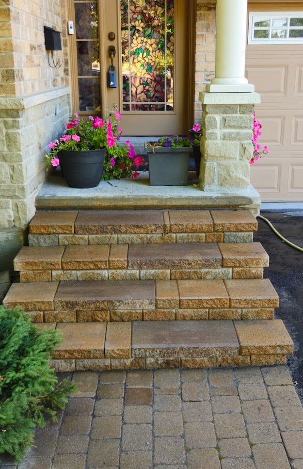 Replacing a cracked paving stone.