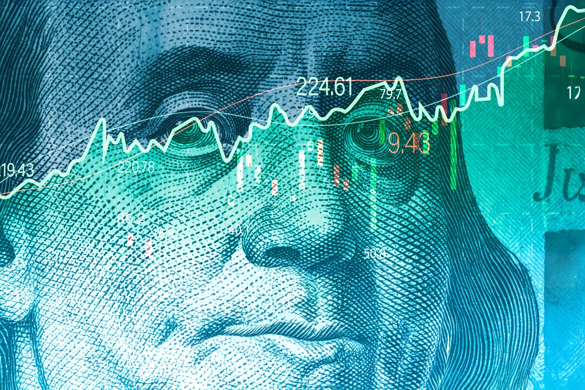 Stock market graph overlaid on Benjamin Franklin's face
