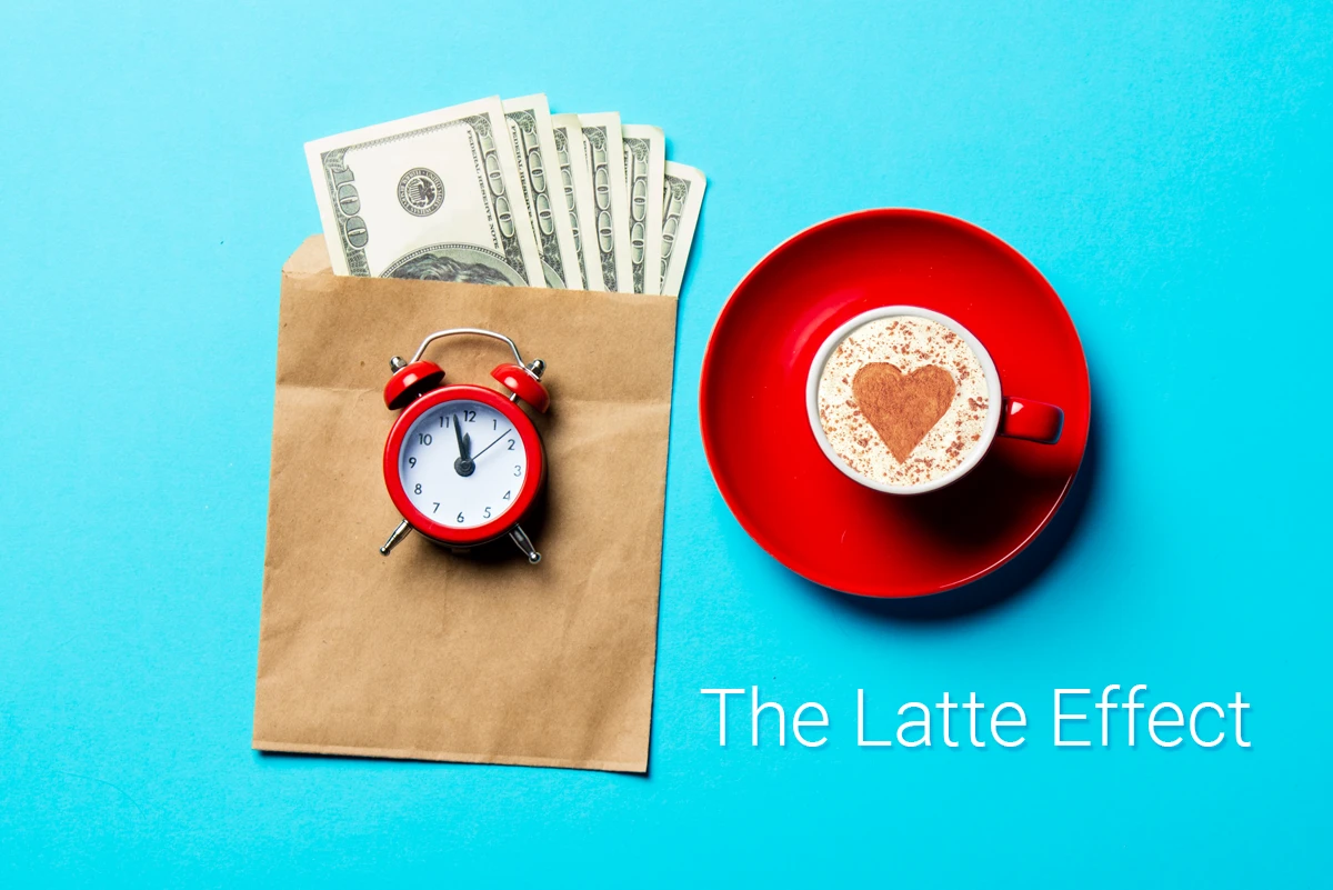 Money in envelope, alarm clock, heart-shaped latte art
