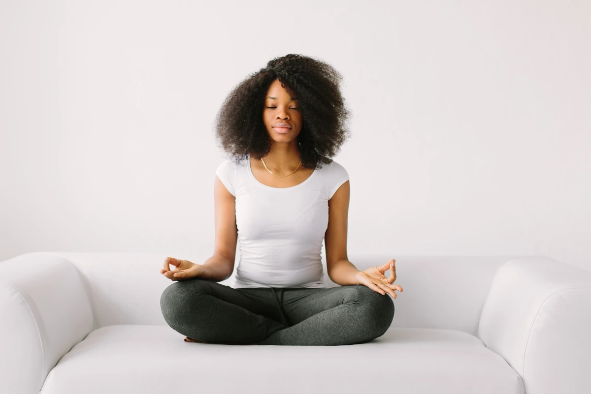 A woman pauses to reflect before making a planned money decision