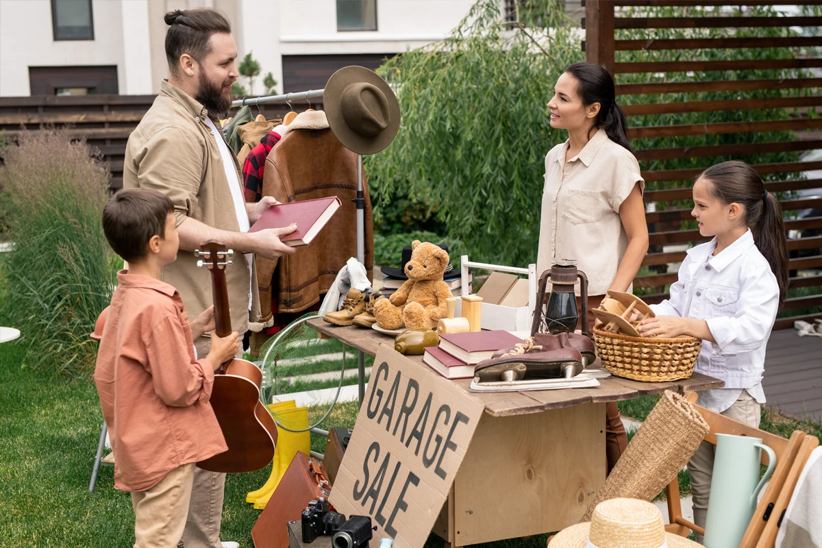 Family enjoying shopping at a backyard garage sale
