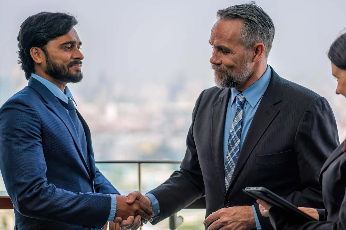 Business owners discussing value before a transfer, buyout, or succession agreement.