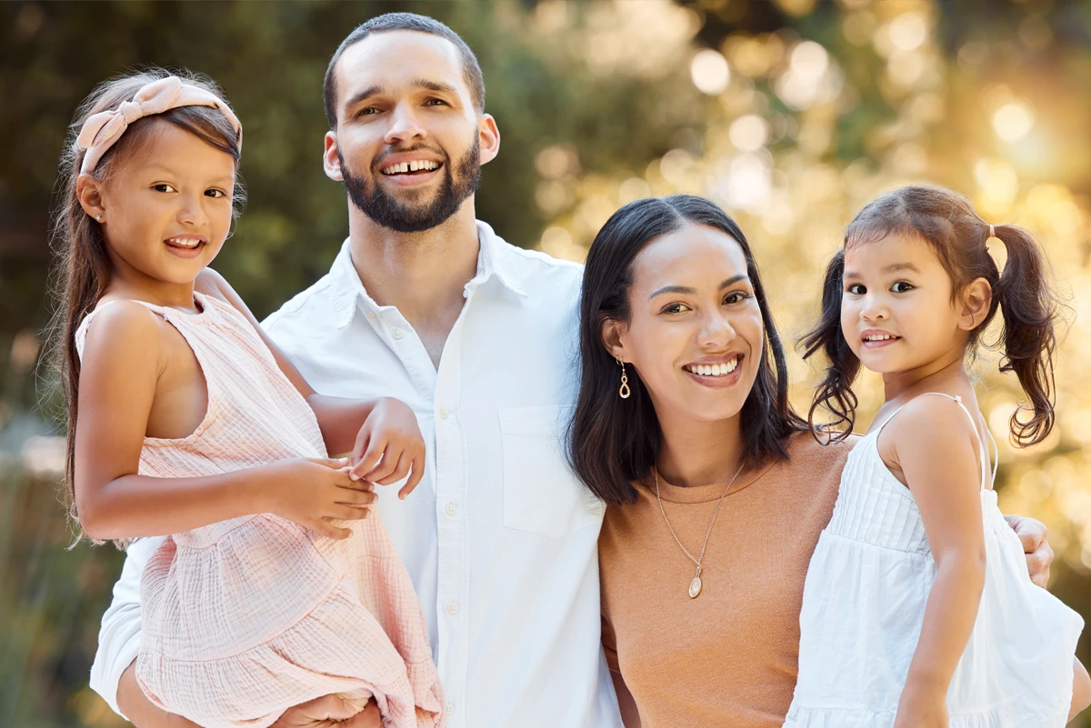 Happy family enjoying a sunny day outdoors.