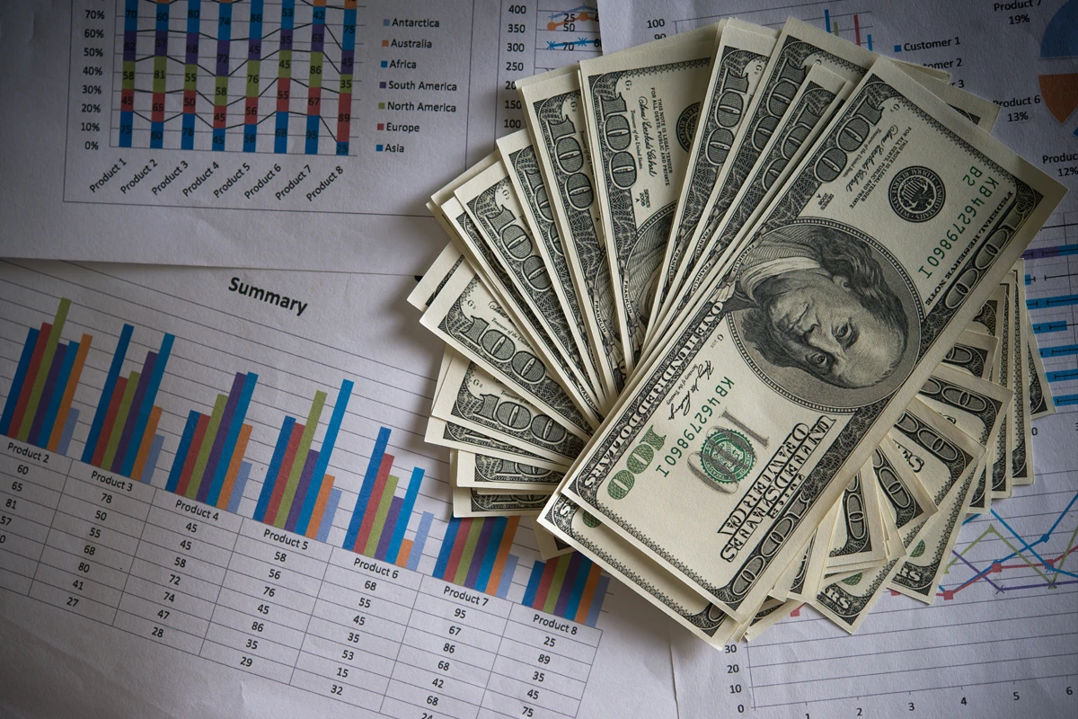 U.S. dollar bills on business financial charts