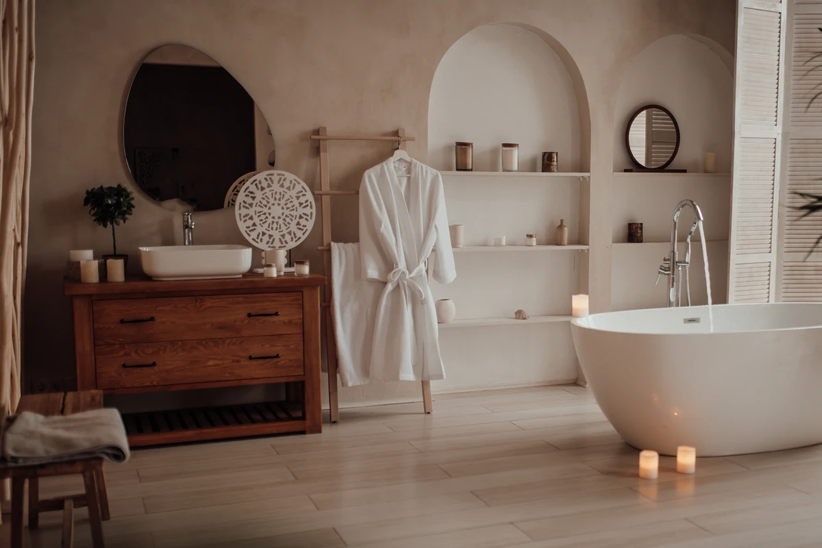 a bathroom with a bathrobe and a tub