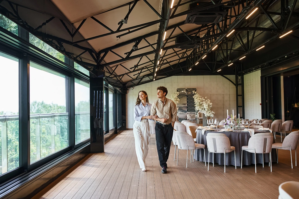 Elegant couple walking in upscale restaurant interior