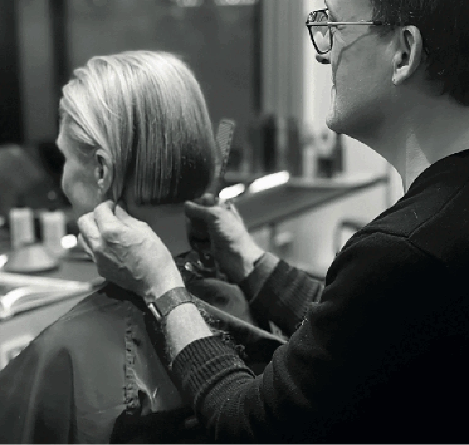 Hairdresser styling a client's hair