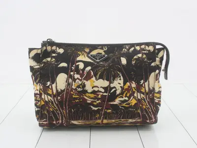 dark aloha print clutch bag, nylon, with strap.