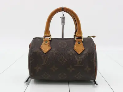 Mini Speedy handbag with strap, Monogram pattern.