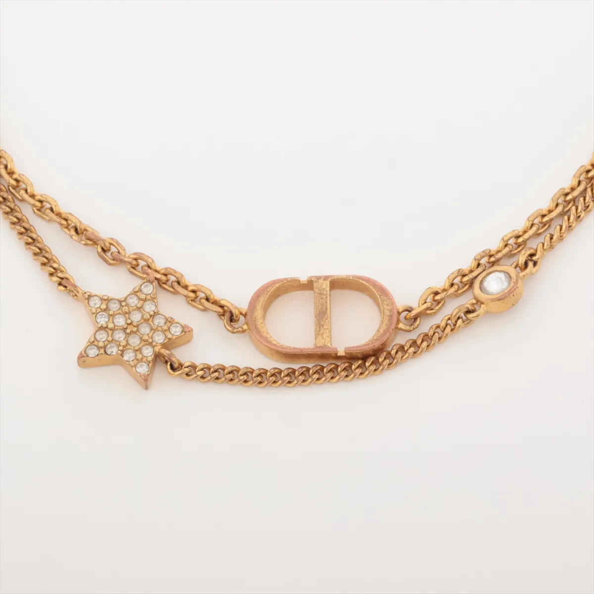 Petit CD bracelet, gold-plated with rhinestones. Shows signs of wear, including — view 2