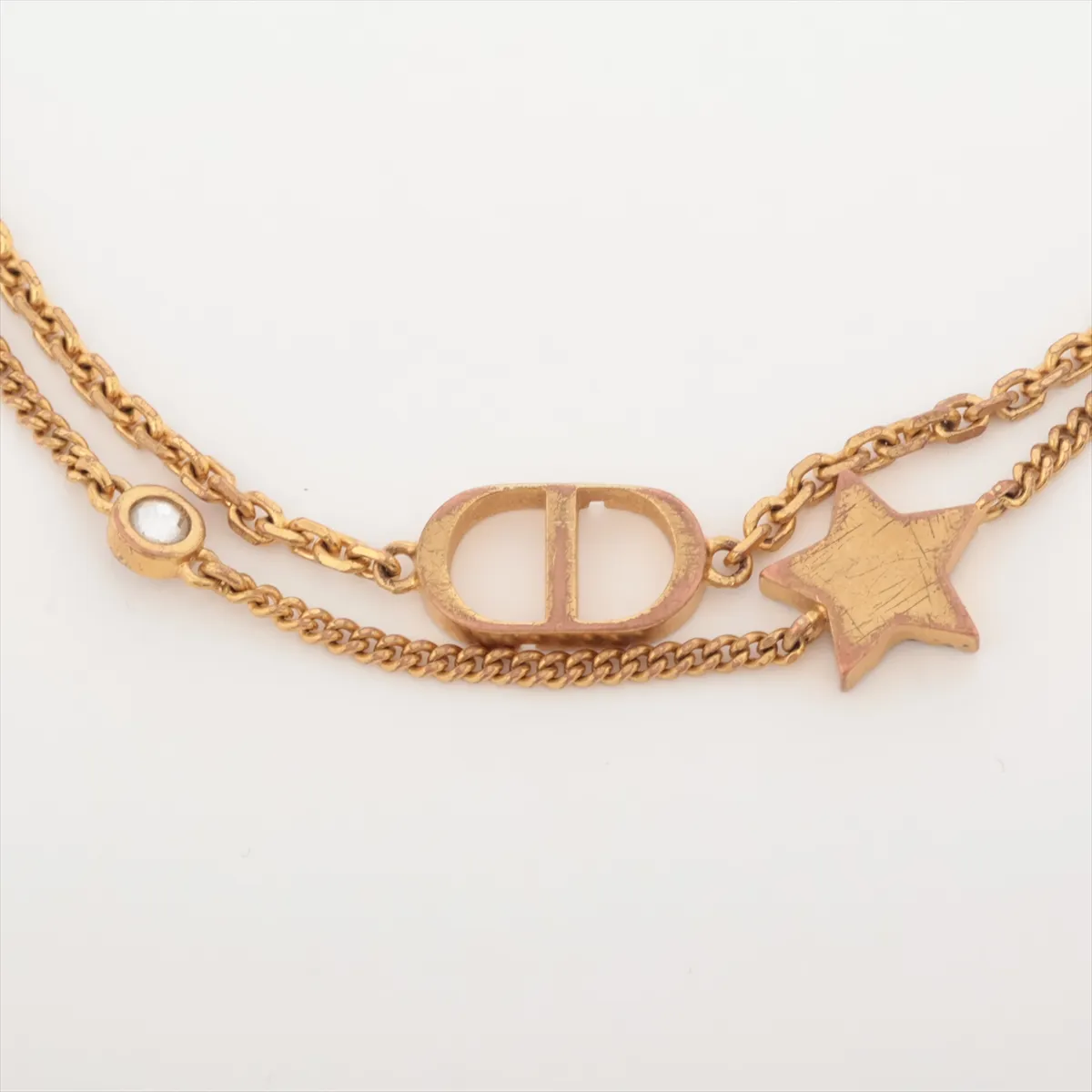 Petit CD bracelet, gold-plated with rhinestones. Shows signs of wear, including — view 3