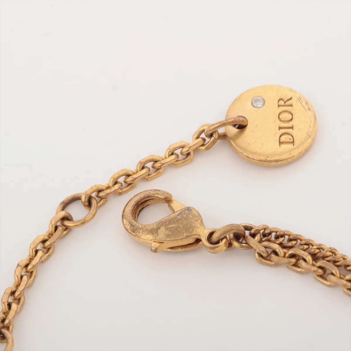 Petit CD bracelet, gold-plated with rhinestones. Shows signs of wear, including — view 4
