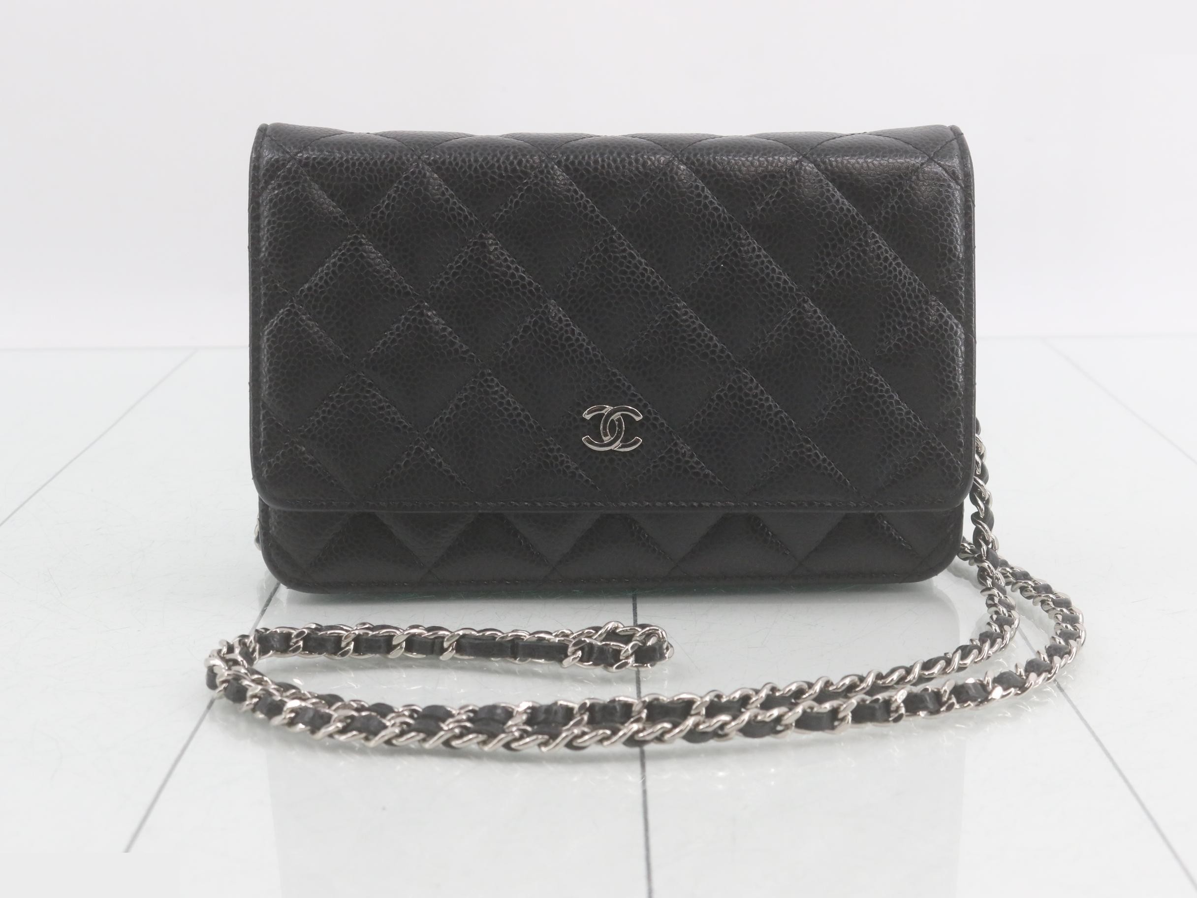 Caviar leather chain wallet with seal, serial number in the 25 range.