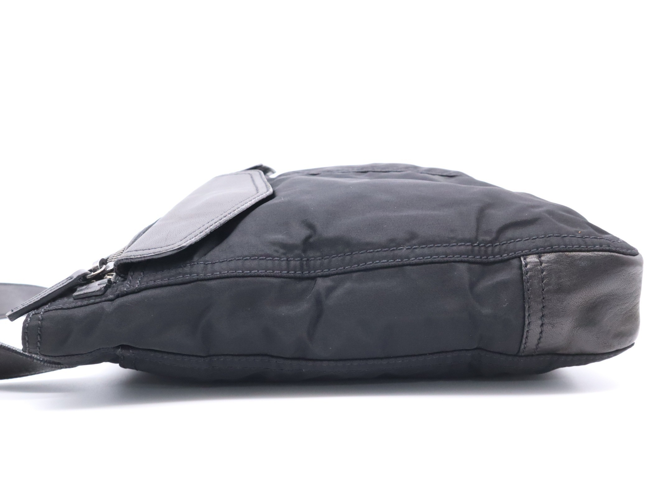 Nylon shoulder bag with triangular logo, black, silver hardware, and card included. — view 3