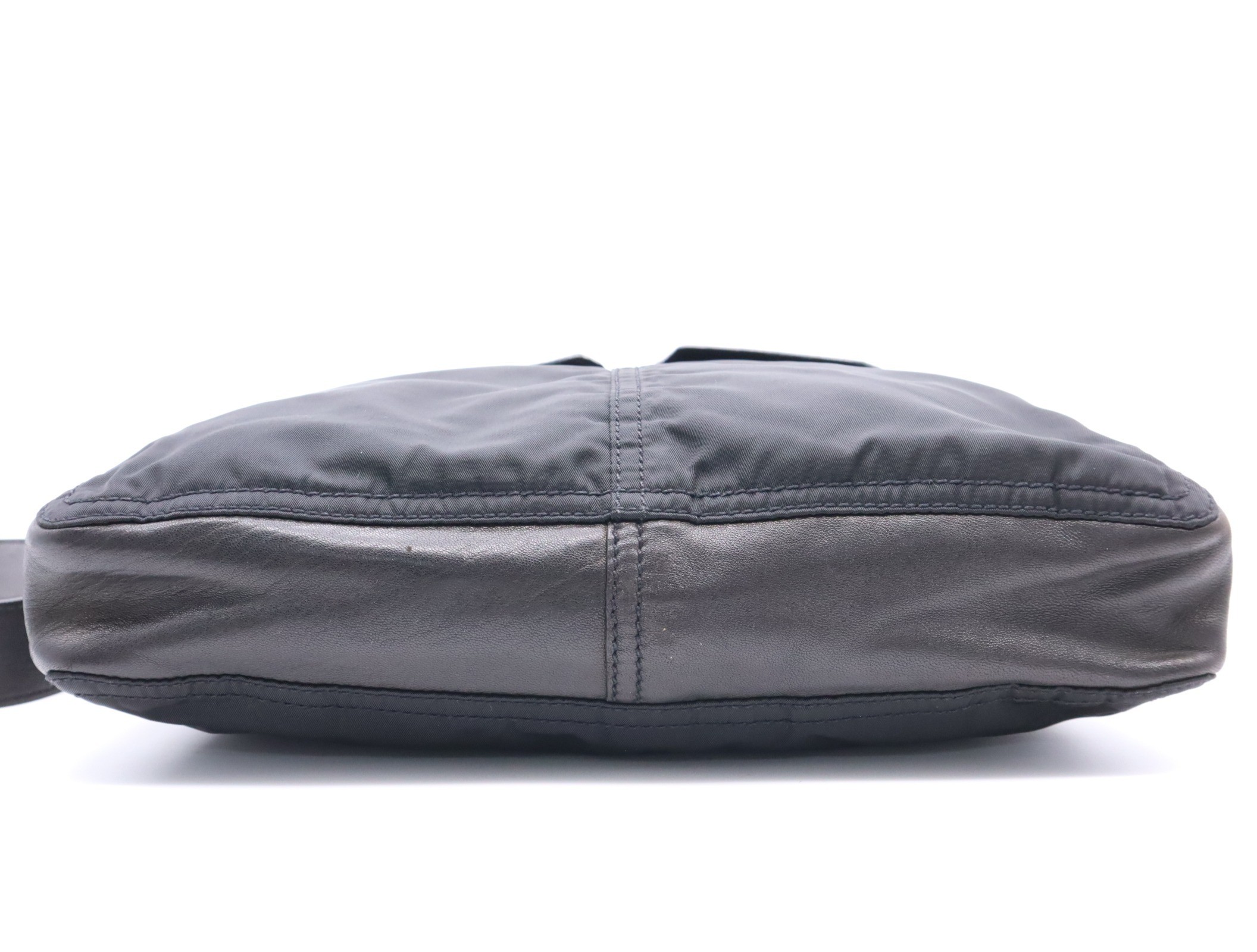 Nylon shoulder bag with triangular logo, black, silver hardware, and card included. — view 4