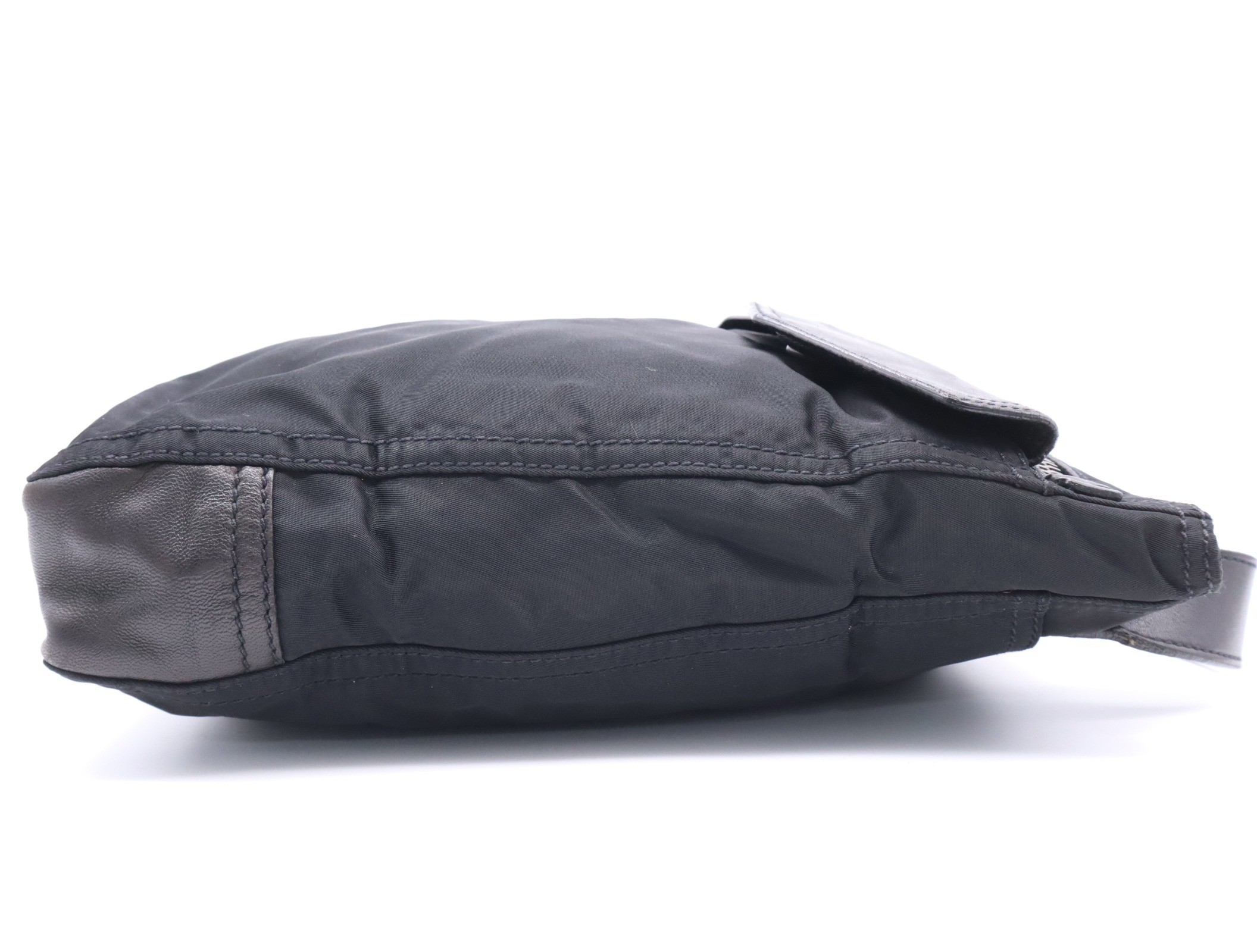 Nylon shoulder bag with triangular logo, black, silver hardware, and card included. — view 5